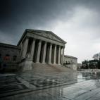 The front of the U.S. Supreme Court under cloudy skies