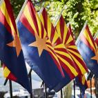 A row of Arizona state flags