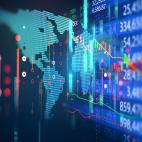 Map of the world on a computer screen overlaid with a stock chart
