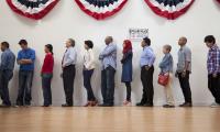 Voters wait in line to cast their ballots.