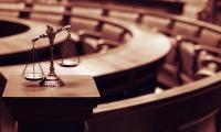 scales of justice in a courtroom