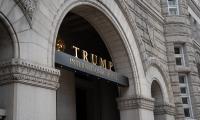 The sign on the front of the Trump International Hotel