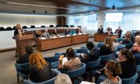 Panelists speaking in front of an audience at the Federal Election Commission