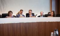 FEC Commissioners sitting behind their desk