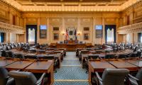 A wide angle view down the aisle of the Virginia House chambers