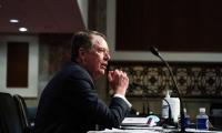 Robert Lighthizer sitting at a desk in front of a microphone