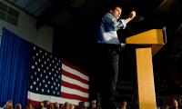Scott Walker giving a speech at a podium with an American flag in the background.
