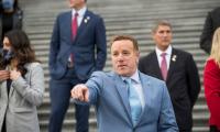 Pat Fallon standing on the steps of the U.S. Capitol pointing towards the camera