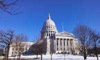 The Wisconsin State Capitol building on a winter day with blue sky