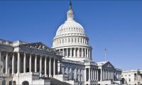 The U.S. Capitol Building against a blue sky