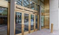 The front doors of the Federal Communications Commission building