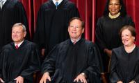 Close-up of Justice Samuel Alito seated in the official Supreme Court portrait