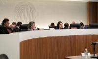 FEC commissioners Shana Broussard, Ellen Weintraub and Dara Lindenbaum seated at a long curved table during a hearing.