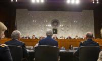 A Senate Foreign Relations Committee hearing, with witnesses sitting at a table before Senators of the committee