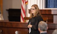 Allison Riggs wearing judge's robes in a courtroom