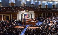 Members of Congress in the House chamber