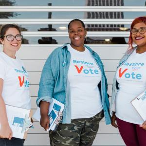 Three organizers for Restore Your Vote Tennessee posing for a photo
