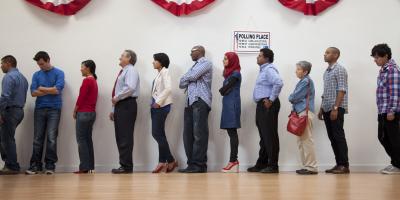 Voters wait in line to cast their ballots