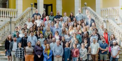 CLC staff members standing in a group on some stairs