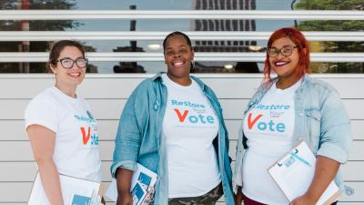 Three organizers for Restore Your Vote Tennessee posing for a photo