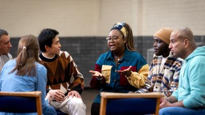 A group of people sitting together having a conversation