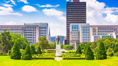 A skyline of city buildings behind a city park in Baton Rouge, Louisiana