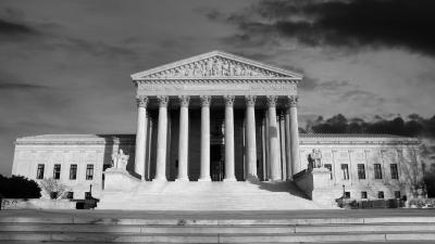 A black and white image of the U.S. Supreme Court on a cloudy day