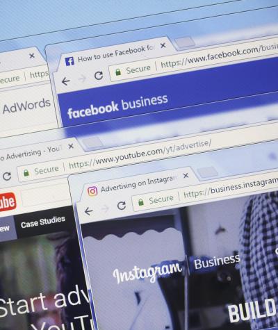 Web browser tabs showing Facebook and Google ad products