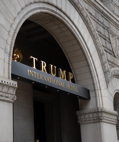 The sign on the front of the Trump International Hotel