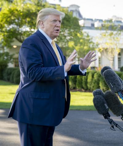 President Donald Trump speaking to the press in front of the White House