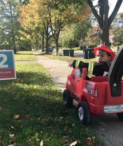 This photo is of Nancy's then two-year old son, Kai, who pedaled door-to-door canvassing to spread the word about Prop 2. Photo courtesy of Voters Not Politicians. 