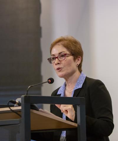 Marie Yovanovitch speaking at a podium.