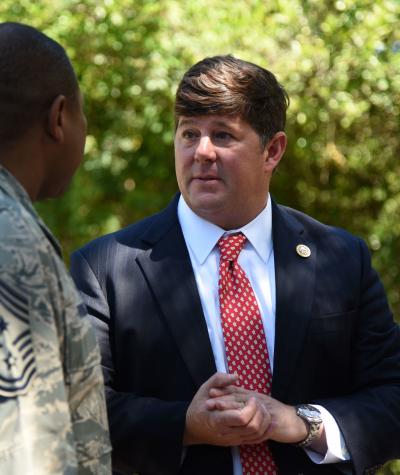 Steven Palazzo speaking to a man in military fatigues