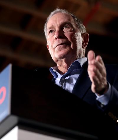 Michael Bloomberg speaking at a podium
