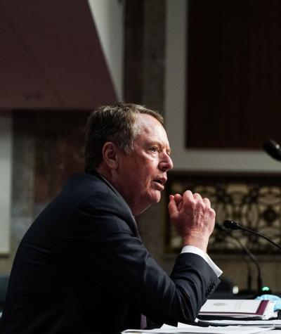 Robert Lighthizer sitting at a desk in front of a microphone