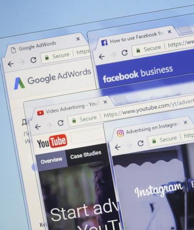 Windows for different websites stacked on top of each other showing Instagram, Facebook, YouTube and Google ads