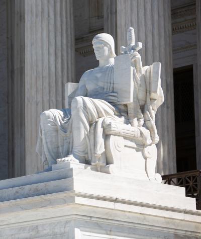 A statue in front of the Supreme Court building