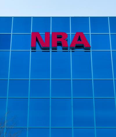 The letters NRA on the outside of the headquarters of the National Rifle Association