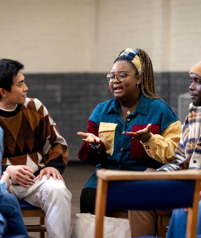 A group of people sitting together having a conversation