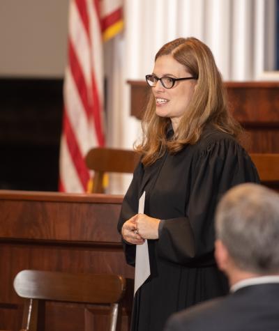 Allison Riggs wearing judge's robes in a courtroom