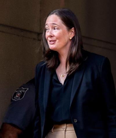 Maurene Comey exiting a building