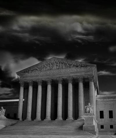A black and white photo of the Supreme Court building on a stormy day