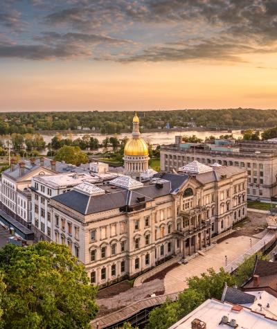 Aerial panorama of Trenton New Jersey skyline amd state capitol at sunset.