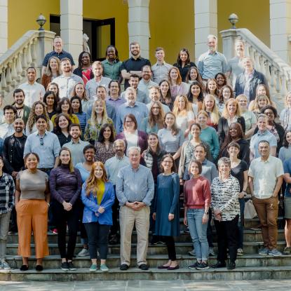 CLC staff members standing in a group on some stairs