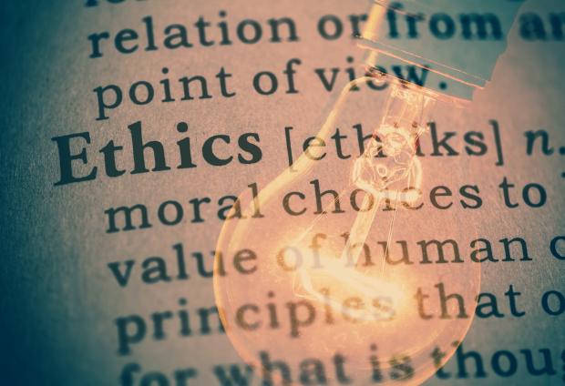 Lightbulb overlaid on definition of "ethics"