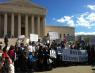 People gathered in front of the U.S. Supreme Court with signs saying "Overturn Citizens United"