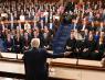 Trump gesturing while speaking to seated members of Congress and Supreme Court justices with his back to the camera