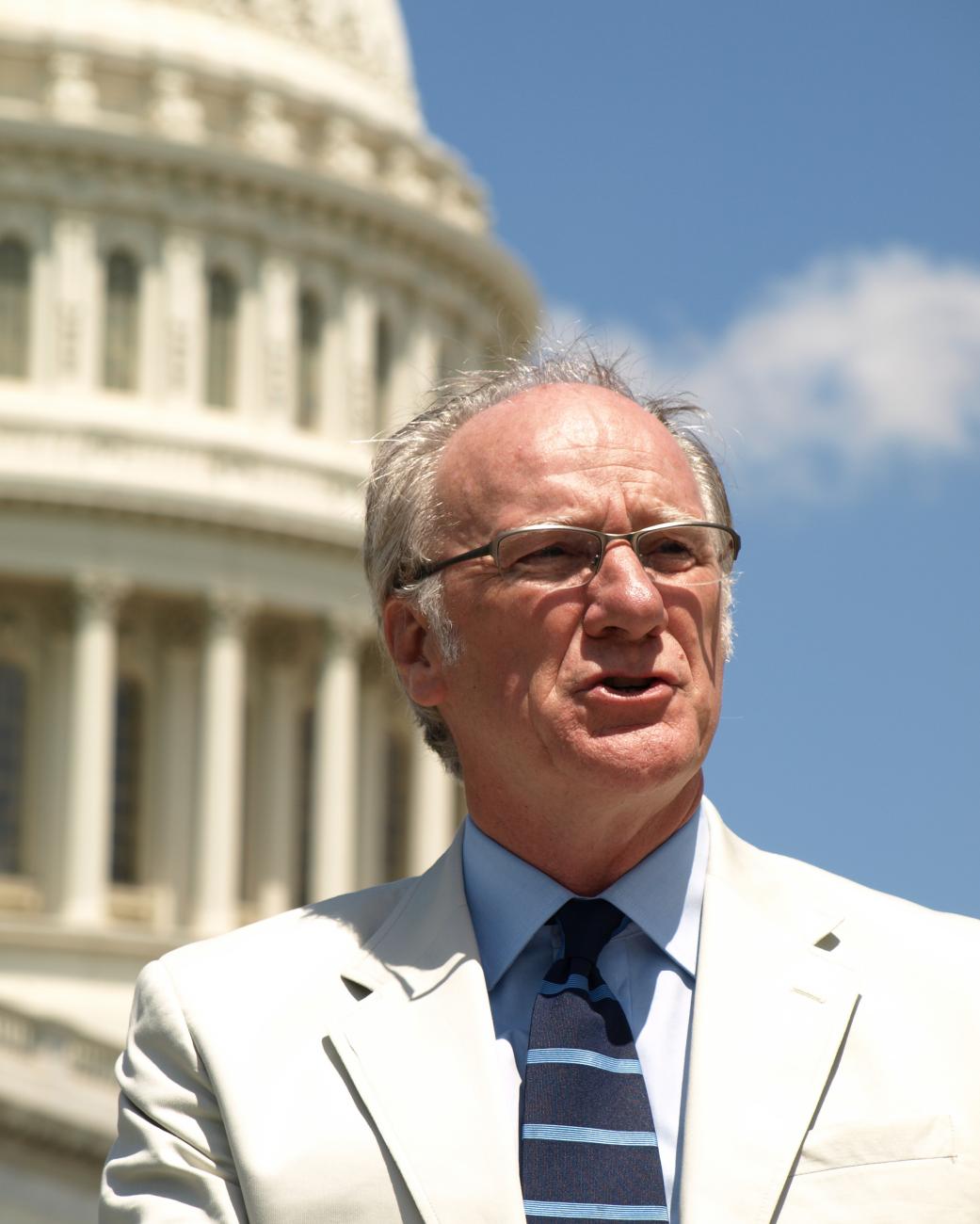 Gerry Hebert speaking with the Capitol Building in the background